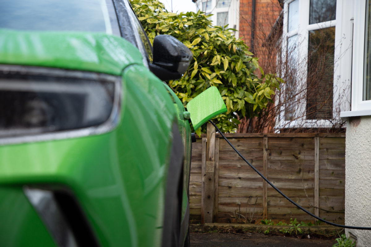green car charging home